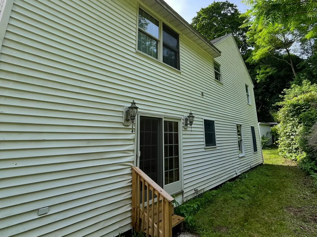 The same residential siding after exterior cleaning