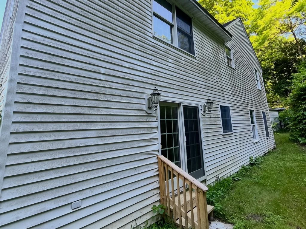 Residential siding before exterior cleaning