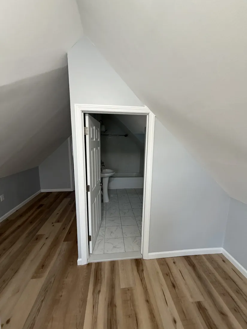 Finished interior room with updated surfaces and flooring